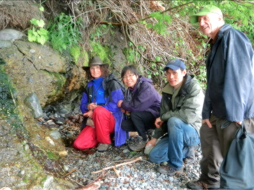 Team of Bryologists and Kem Luther examining habitat of Crumia sp. 